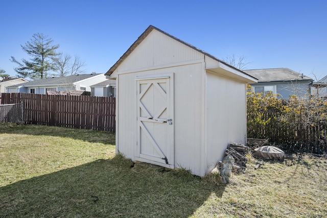 view of shed with fence