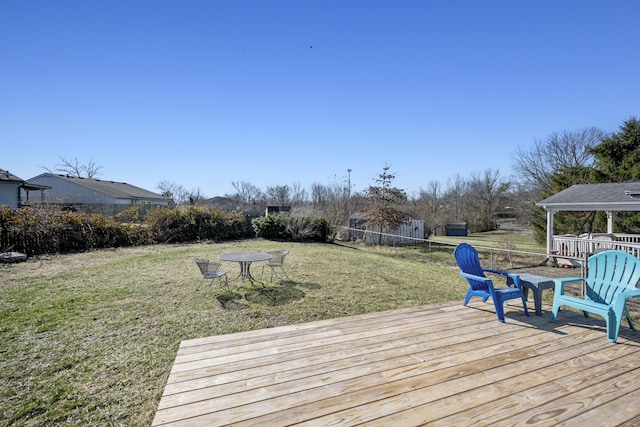 wooden deck with a yard, a gazebo, and fence