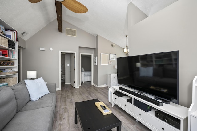 living room with baseboards, ceiling fan, visible vents, and wood finished floors