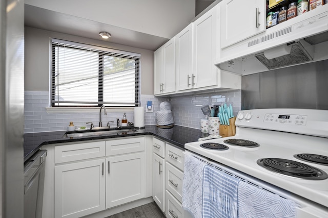 kitchen featuring tasteful backsplash, white range with electric stovetop, white cabinets, under cabinet range hood, and a sink