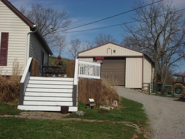 view of side of property featuring a detached garage