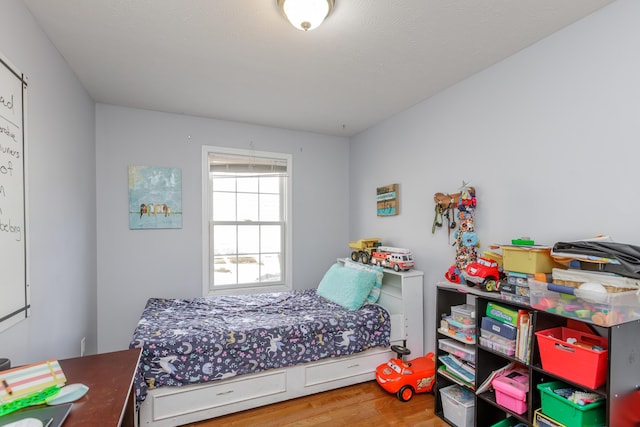 bedroom featuring wood finished floors