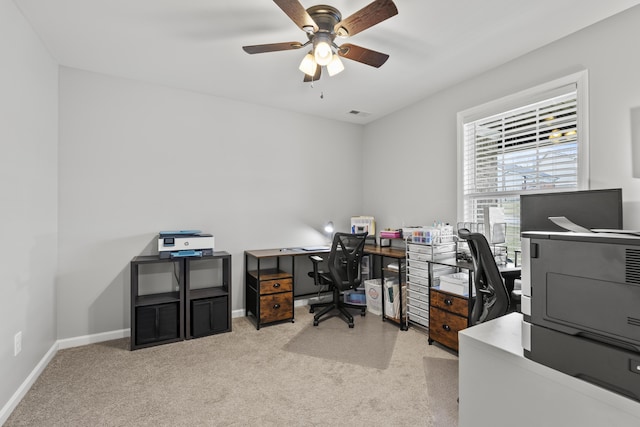 office with light carpet, visible vents, baseboards, and a ceiling fan