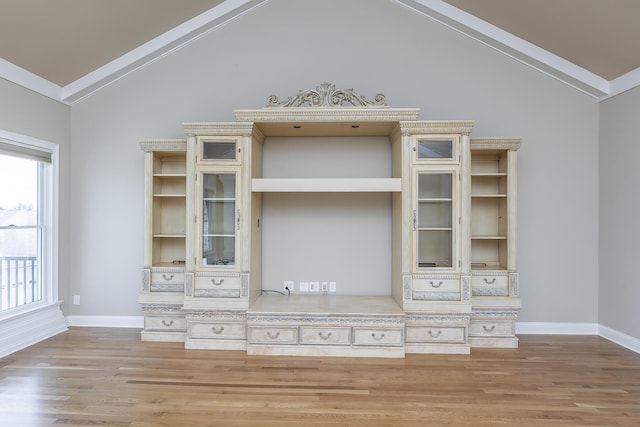interior details with baseboards and wood finished floors