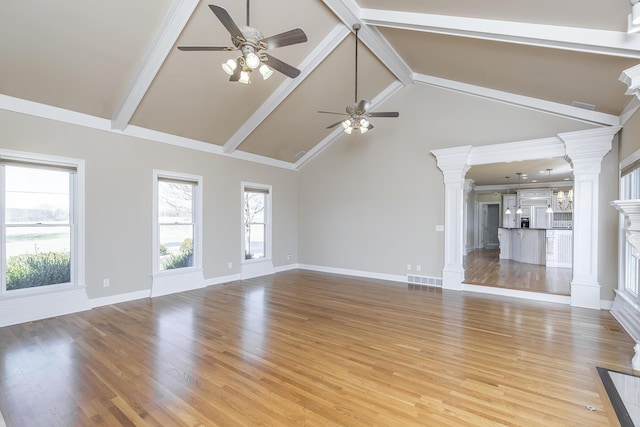 unfurnished living room featuring light wood finished floors, beamed ceiling, decorative columns, and ceiling fan