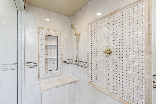 full bathroom with tiled shower