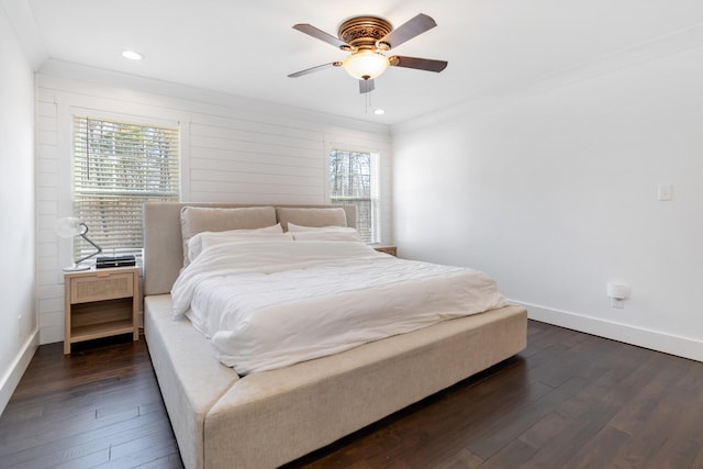 bedroom with ornamental molding, recessed lighting, dark wood finished floors, and baseboards