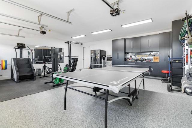 playroom featuring a garage and light speckled floor