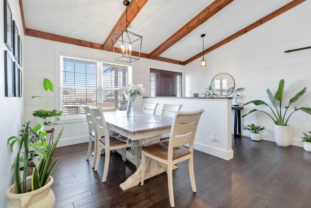 dining space with lofted ceiling with beams, dark wood-style floors, and baseboards