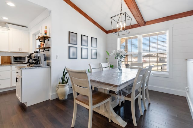 dining space featuring baseboards, lofted ceiling with beams, dark wood-type flooring, a chandelier, and recessed lighting