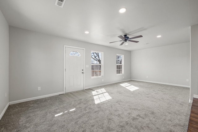 interior space with a ceiling fan, recessed lighting, visible vents, and baseboards