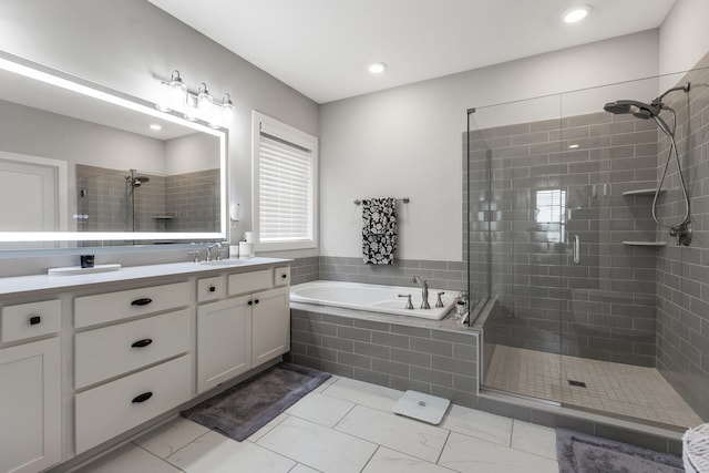 bathroom featuring double vanity, a stall shower, a bath, marble finish floor, and a sink