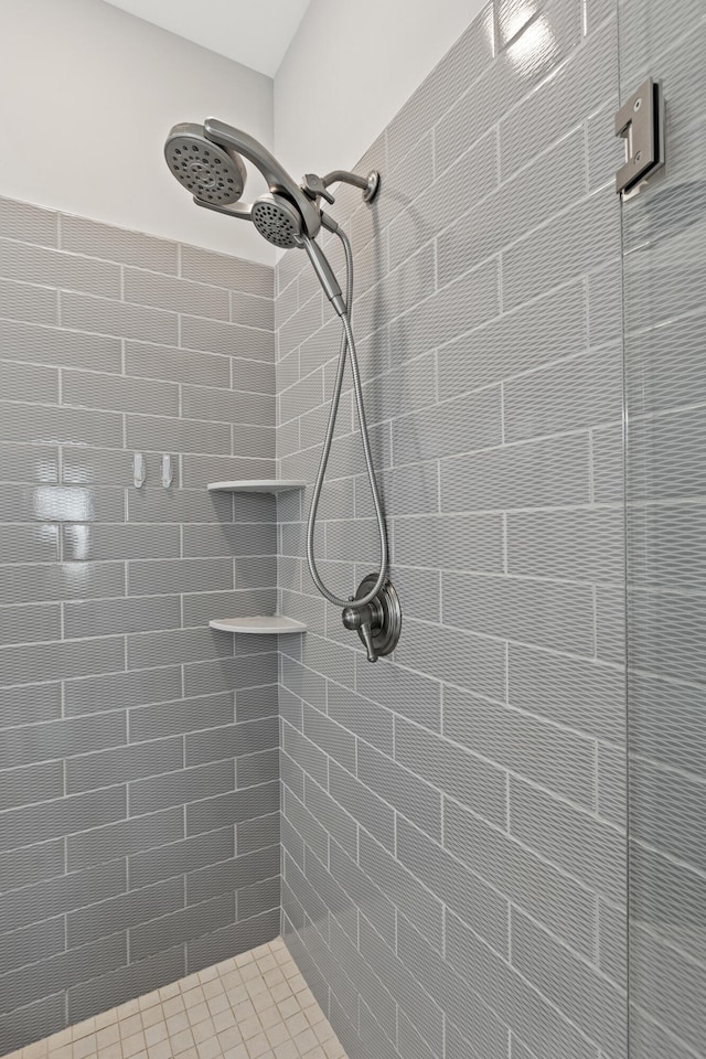 full bath featuring a tile shower