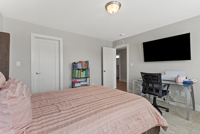 bedroom featuring carpet floors, baseboards, and visible vents