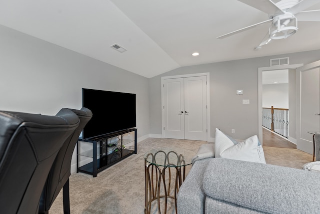 bedroom with visible vents, vaulted ceiling, light carpet, and ceiling fan