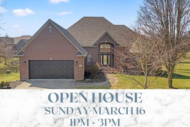 view of front of home featuring a garage, brick siding, concrete driveway, and a front yard