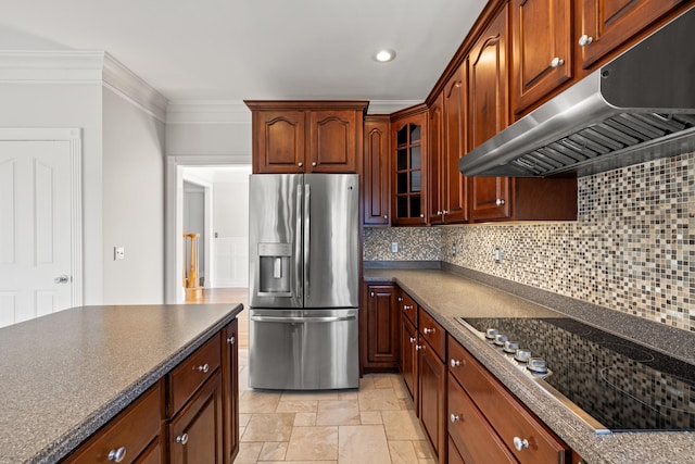 kitchen with dark countertops, black electric stovetop, stainless steel refrigerator with ice dispenser, and under cabinet range hood