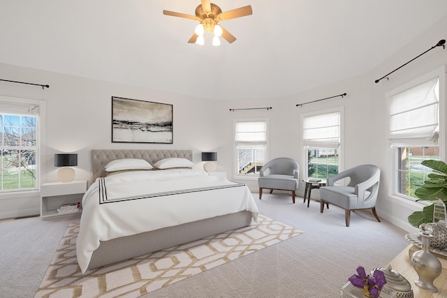 carpeted bedroom featuring a ceiling fan and baseboards