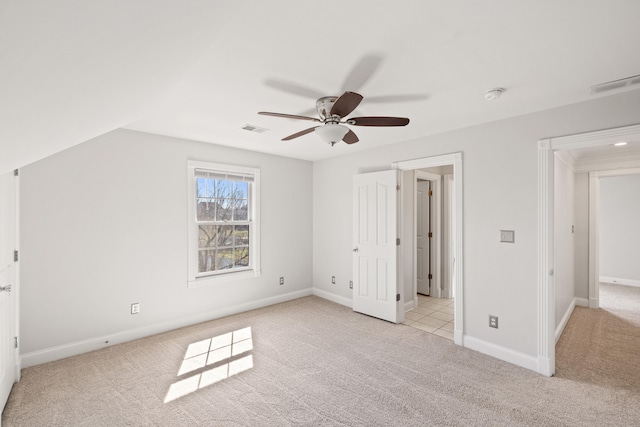 unfurnished bedroom with visible vents, baseboards, and carpet