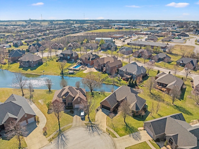 aerial view with a residential view and a water view