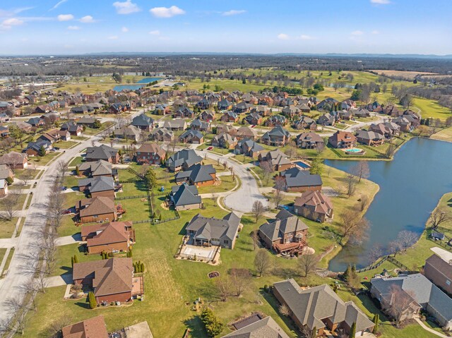 bird's eye view featuring a residential view and a water view