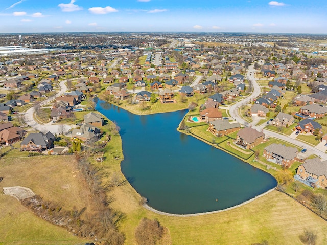 drone / aerial view featuring a residential view and a water view