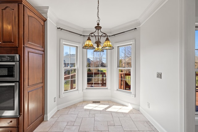 unfurnished dining area with an inviting chandelier, stone finish flooring, baseboards, and ornamental molding