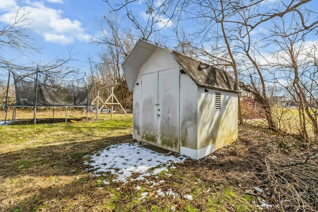 view of shed with a trampoline