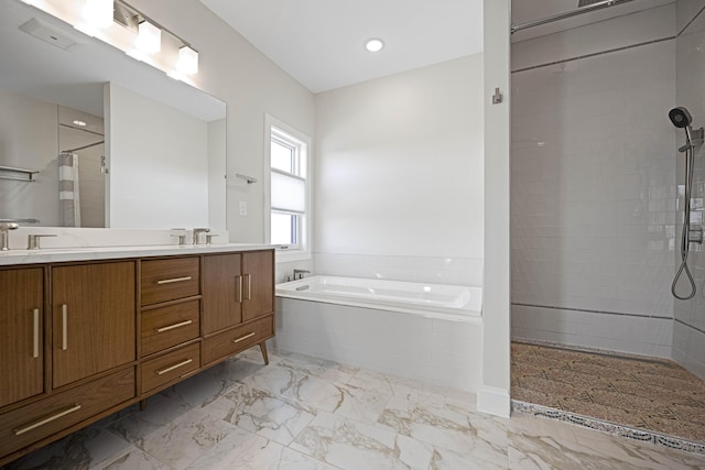 full bathroom with marble finish floor, a garden tub, double vanity, a tile shower, and a sink