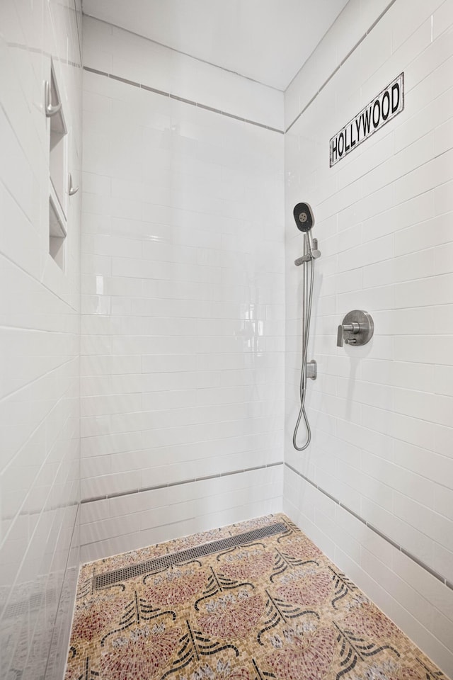 bathroom with tiled shower