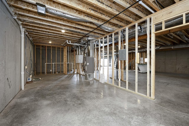 unfinished basement featuring electric panel