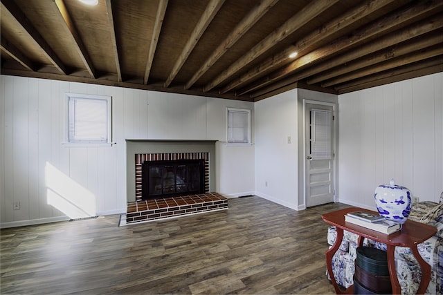living room featuring a fireplace, dark wood-style flooring, and baseboards
