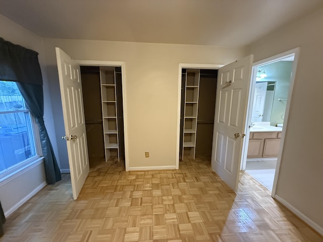 10509 Bay Pointe Ct, Louisville, KY 40241 - unfurnished bedroom with connected bathroom, two closets, and a spacious closet
