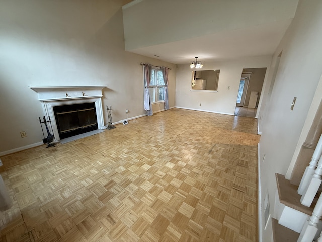 10509 Bay Pointe Ct, Louisville, KY 40241 - unfurnished living room with a fireplace with flush hearth and a chandelier