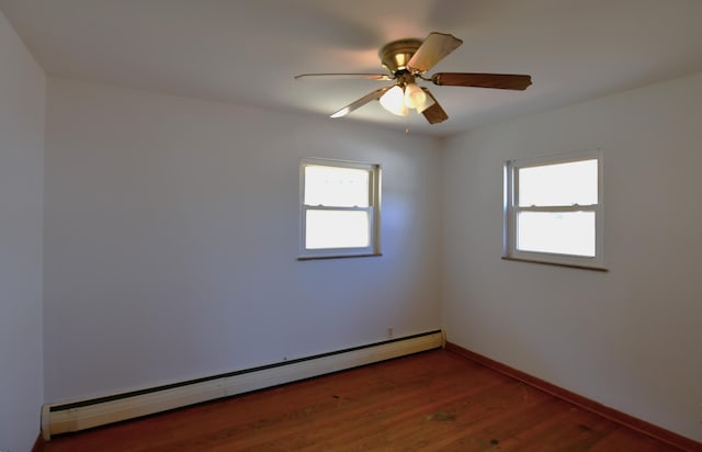 unfurnished room with ceiling fan, dark wood-style flooring, baseboard heating, and baseboards