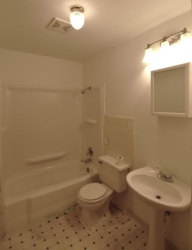 full bath with visible vents,  shower combination, and toilet