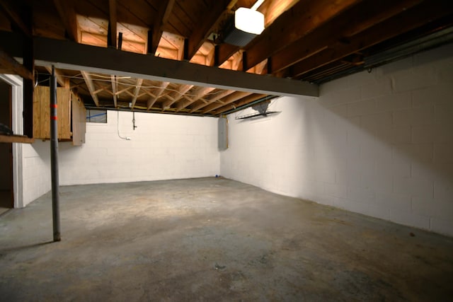 unfinished basement featuring electric panel