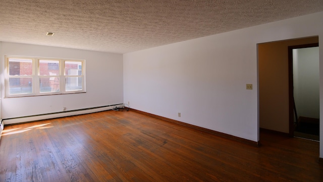 empty room with a baseboard heating unit, dark wood-type flooring, a textured ceiling, and baseboards