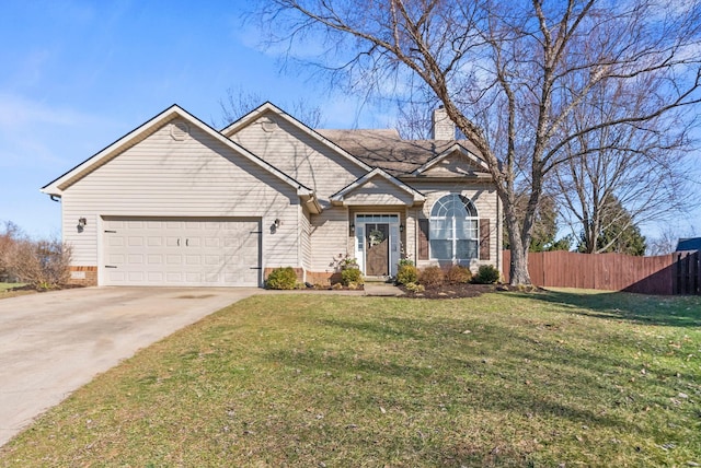 view of front of home with a garage, driveway, fence, and a front lawn