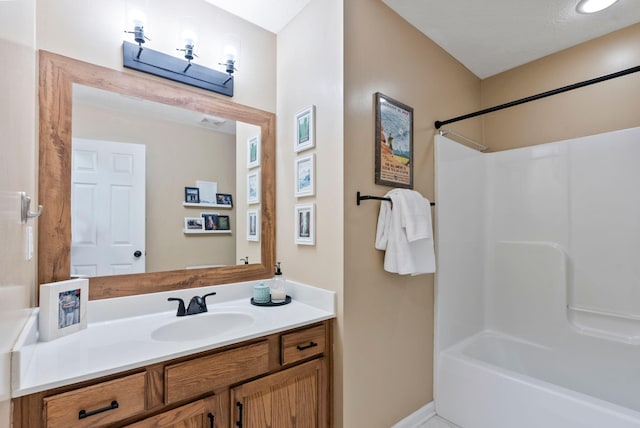 full bathroom with shower / washtub combination and vanity