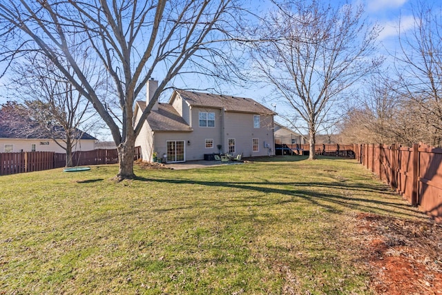 view of yard featuring a patio area and a fenced backyard