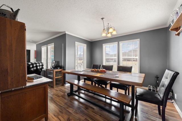 dining room with ornamental molding, dark wood-style flooring, a textured ceiling, and an inviting chandelier