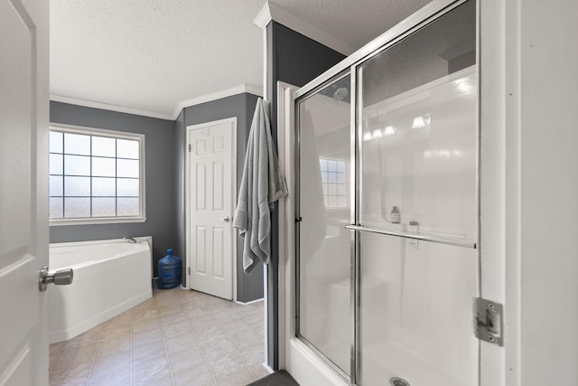 full bathroom featuring a stall shower, a garden tub, crown molding, and a textured ceiling