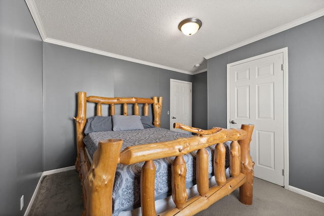 carpeted bedroom featuring baseboards, a textured ceiling, and crown molding