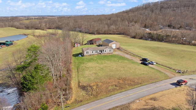 bird's eye view featuring a water view, a view of trees, and a rural view