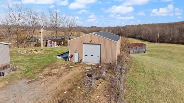 view of outdoor structure featuring driveway and an outdoor structure