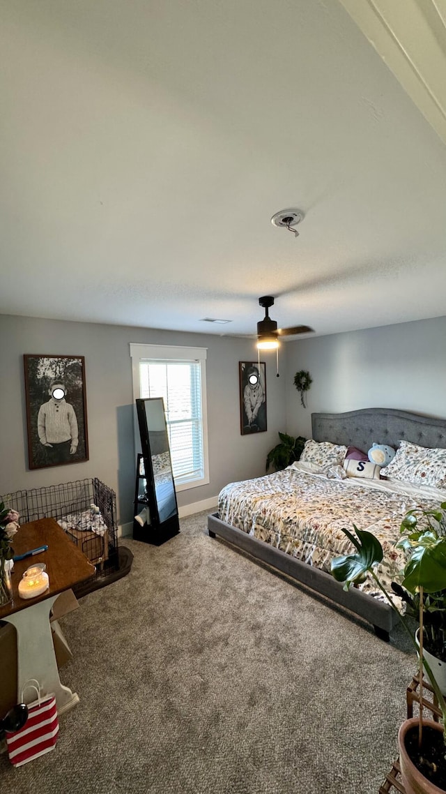 bedroom featuring a ceiling fan, carpet, and baseboards