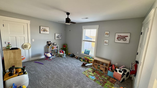 playroom featuring ceiling fan, carpet floors, visible vents, and baseboards