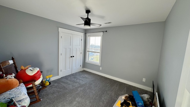 game room with carpet floors, baseboards, visible vents, and a ceiling fan