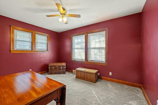 unfurnished bedroom featuring ceiling fan, baseboards, and carpet flooring